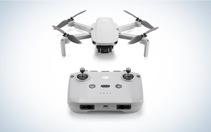  A DJI Mini 2 SE drone on a blue and white background