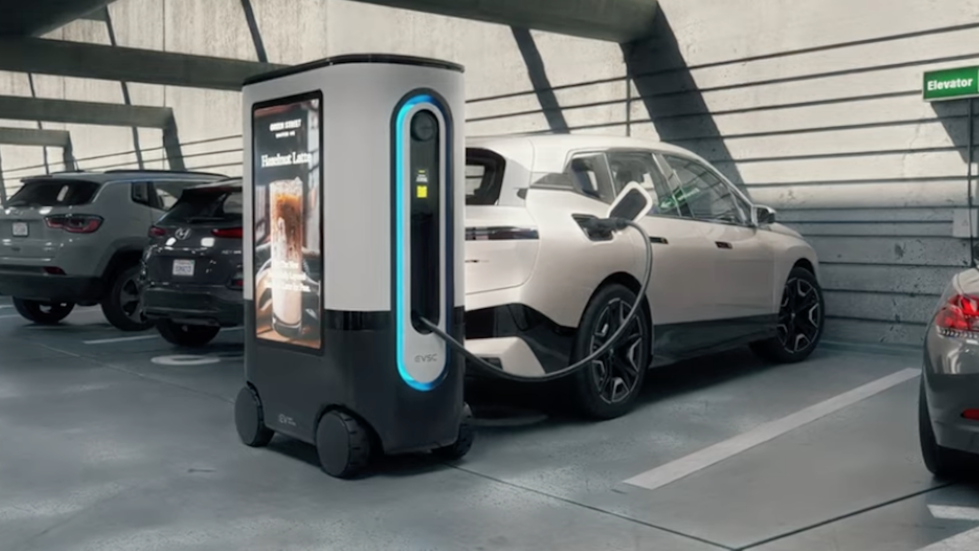 ZiGGY mobile EV charger connected to vehicle in parking lot.