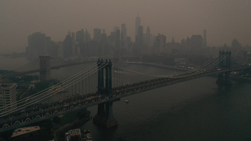 The Downtown Manhattan skyline stands shrouded in a reddish haze as a result of Canadian wildfires on June 6, 2023 in New York City. Over 100 wildfires are burning in the Canadian province of Nova Scotia and Quebec resulting in air quality health alerts for the Adirondacks, Eastern Lake Ontario, Central New York, and Western New York.