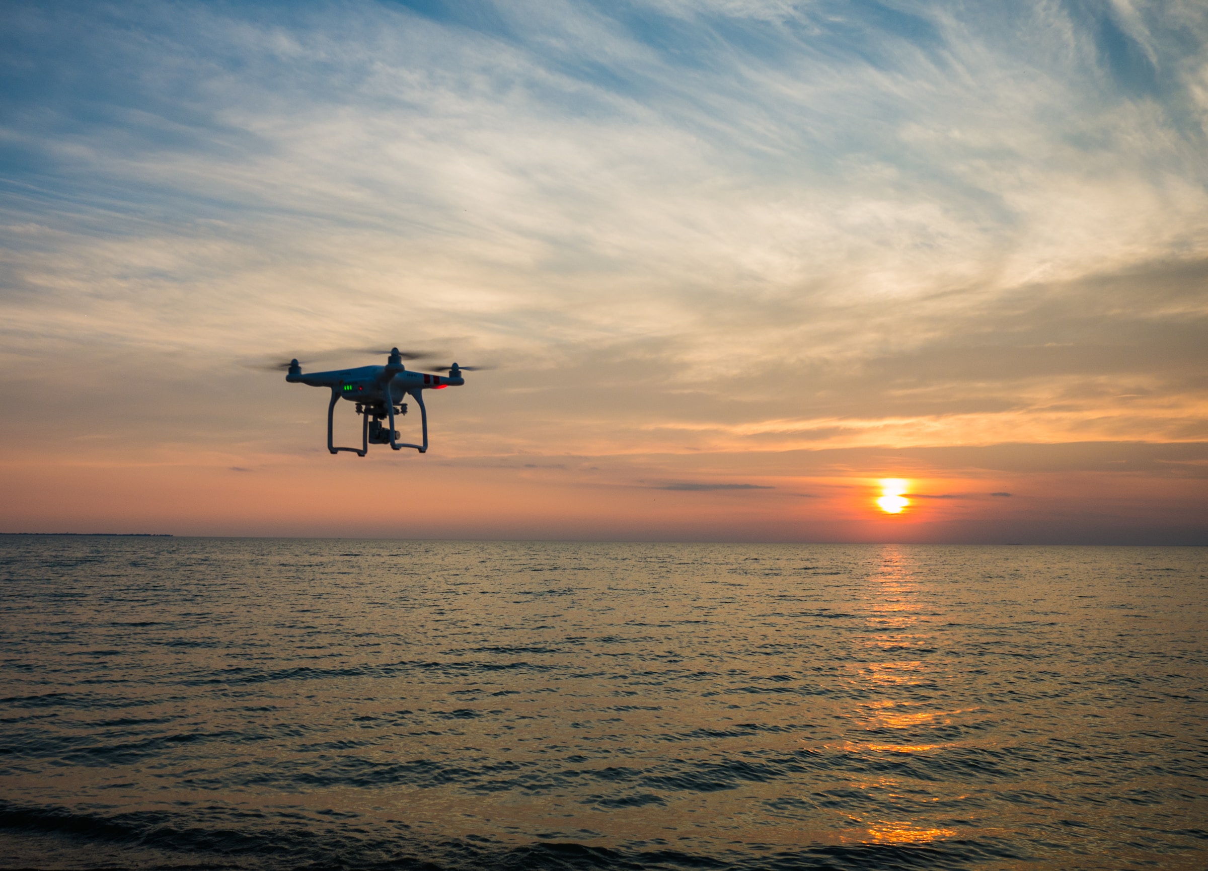 a drone flies over the water