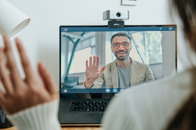 People communicate via a webcam