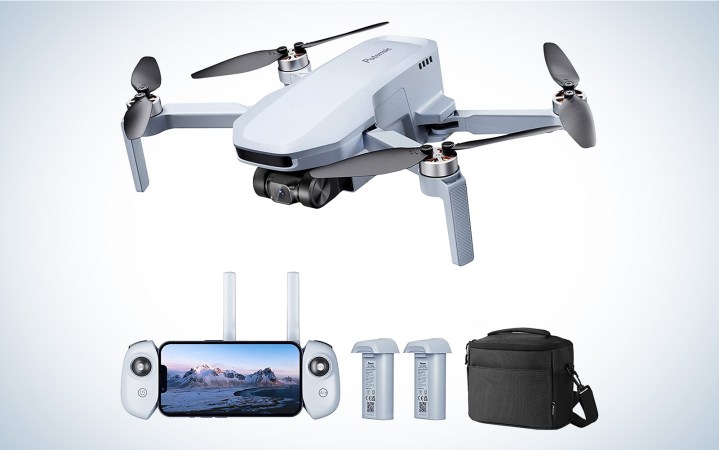  Potensic Atom SE drone with its accessories on a plane background