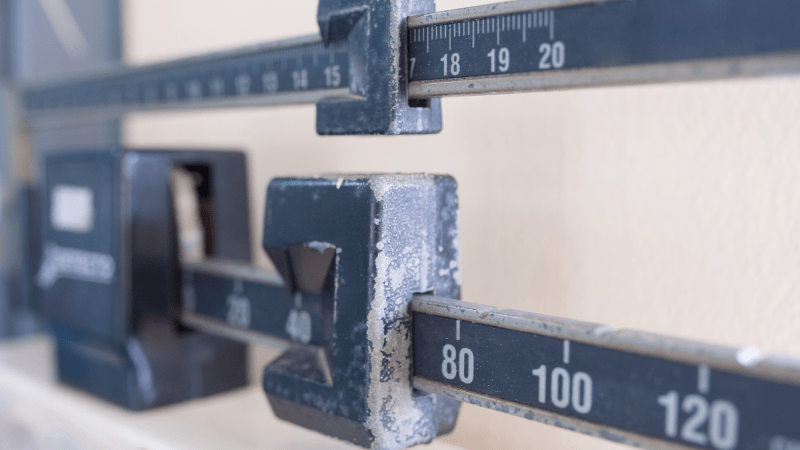 An old scale used for calculating body weight.