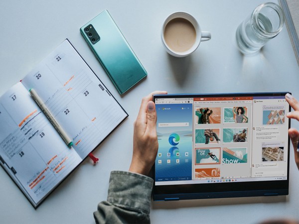 A person works on a Microsoft tablet