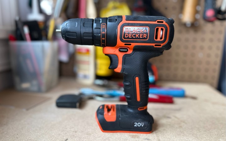  A BLACK+DECKER BDCDD120C on top of a workbench.