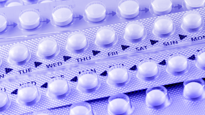 Rows of birth control pills with the days of the week on the label.