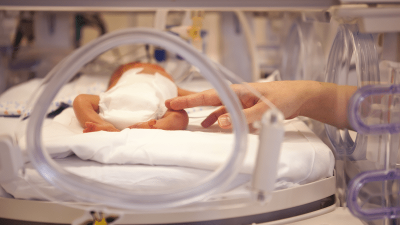 A preterm baby in an incubator in a neonatal intensive care unit. RSV sends about 58,000 children under five to the hospital every year in the United States.