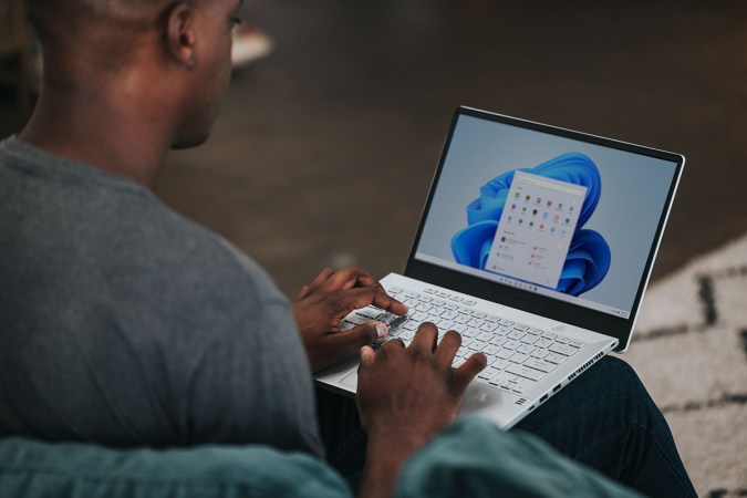 A person using Microsoft Office on a Windows laptop