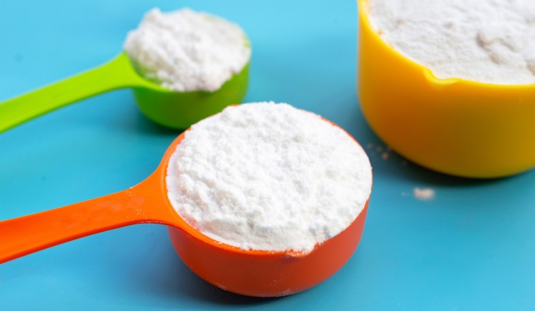 Borax powder in multicolor scoops on a blue background