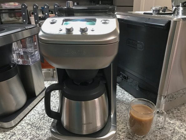  Breville Grind Control best with grinder chrome drip coffee maker on a crowded kitchen counter