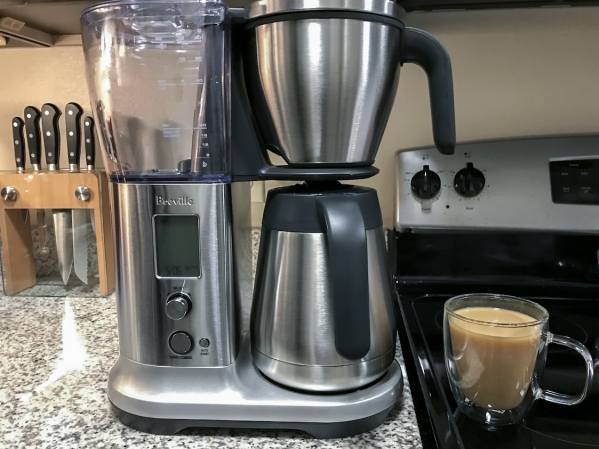  Breville Precision Brewer best overall drip coffeemaker with chrome thermal carafe on a crowded kitchen counter