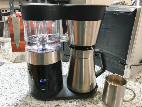  OXO 9-Cup best design curvy chrome drip coffee maker on a crowded kitchen counter