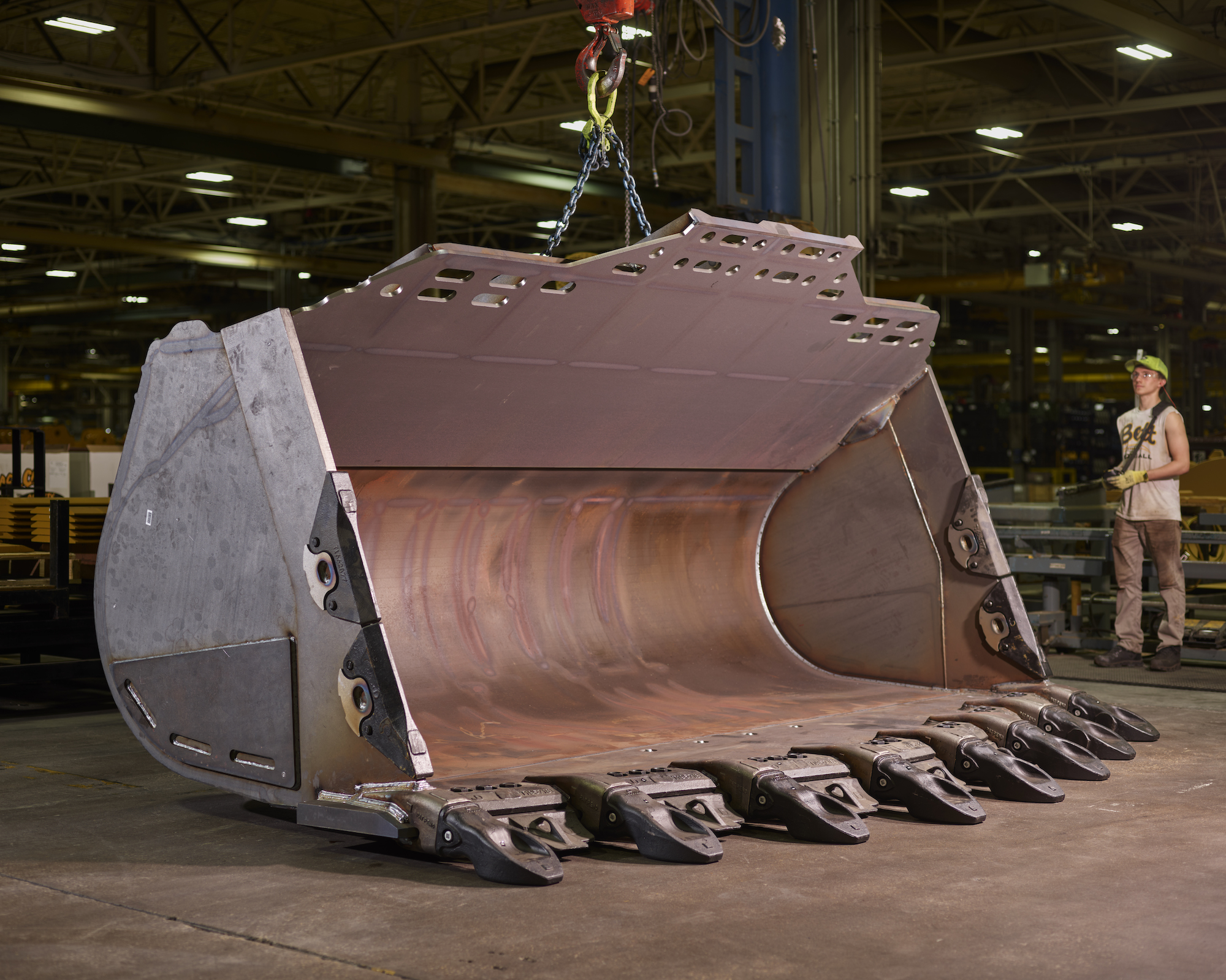 a john deere wheel loader bucket in a factory