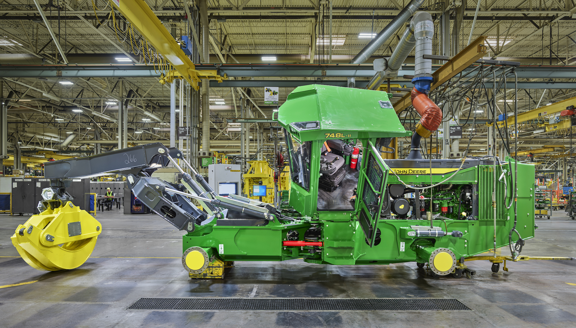 a john deere skidder in a factory