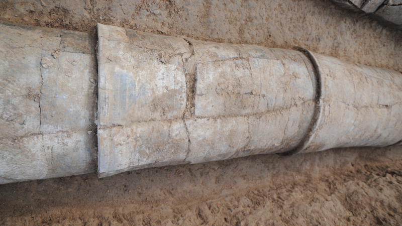 Closeup photo of water pipe segments fitted together in situ at Pingliangtai.