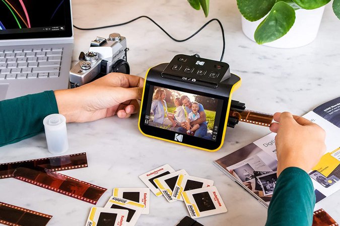 A person using a Kodak film scanner.