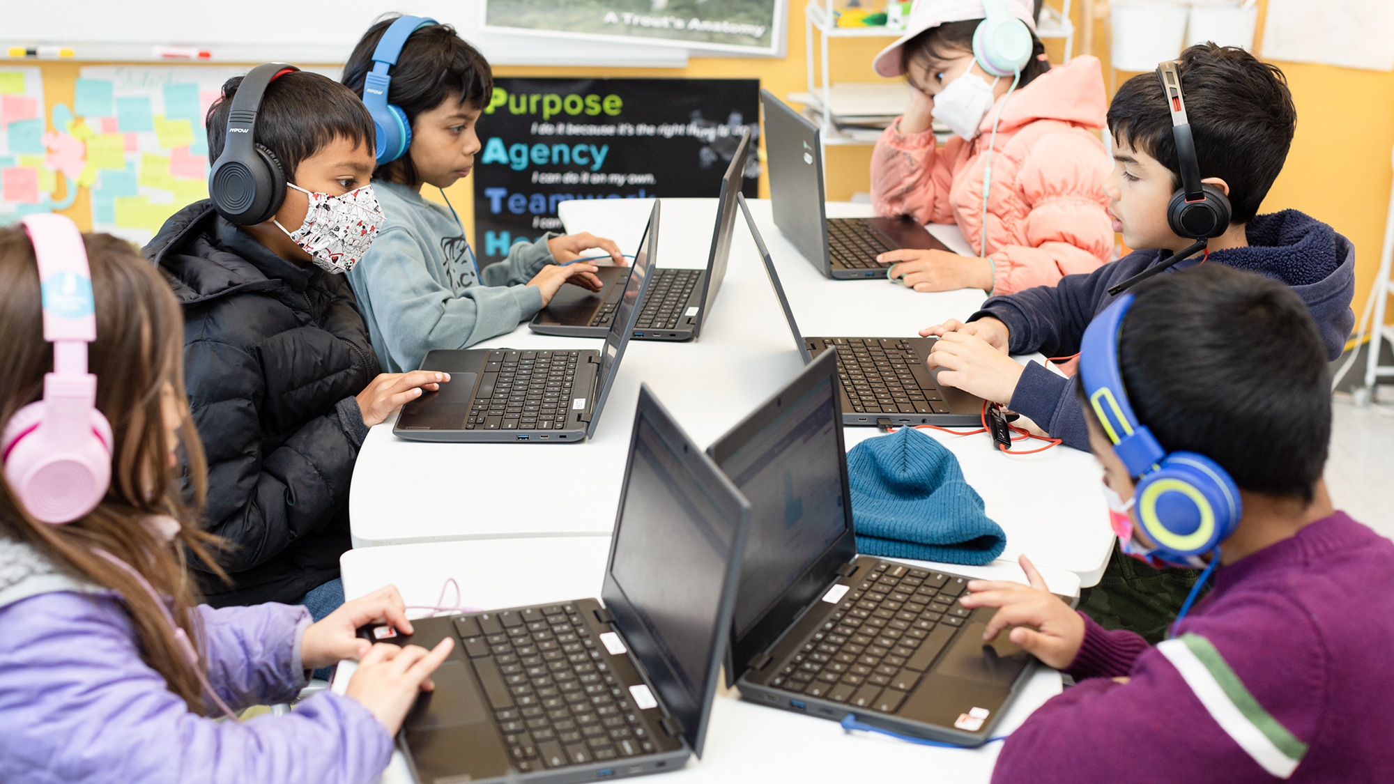 Students testing ChatGPT AI tutor on computers