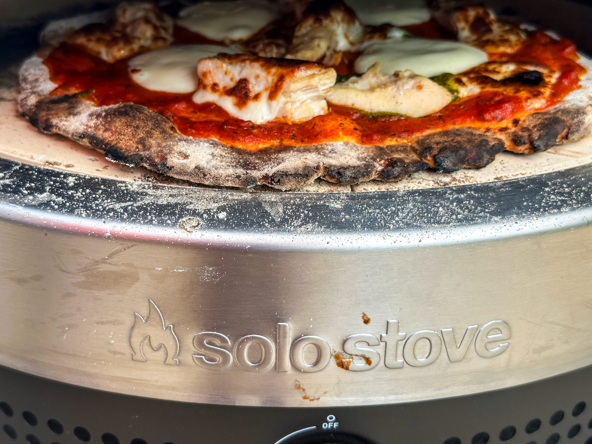 Solo Stove Pi Prime with a pizza cooking inside