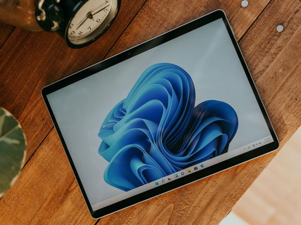 A Windows tablet on a wood desk