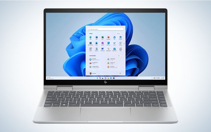  A silver HP-Envy 2-in-1 14-inch laptop on a plain background