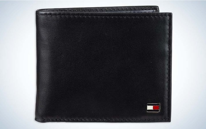  A black version of the Tommy Hilfiger Men's Passcase Wallet against a plain background.