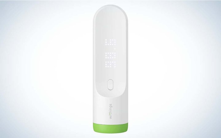  A white Withings Thermo Smart Digital Thermometer with a green ring around the bottom against a plain background.