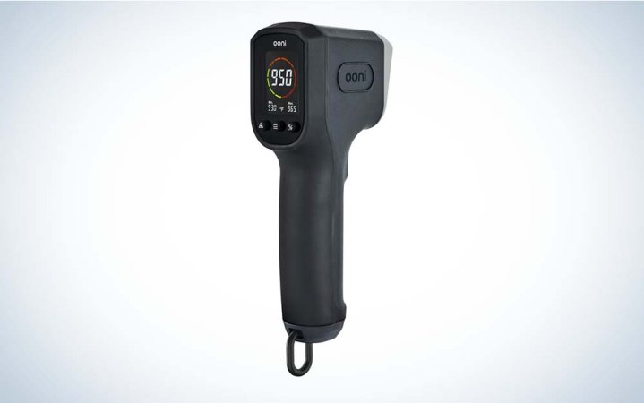  A black Ooni Infrared Digital Thermometer with an LCD display against a plain background.