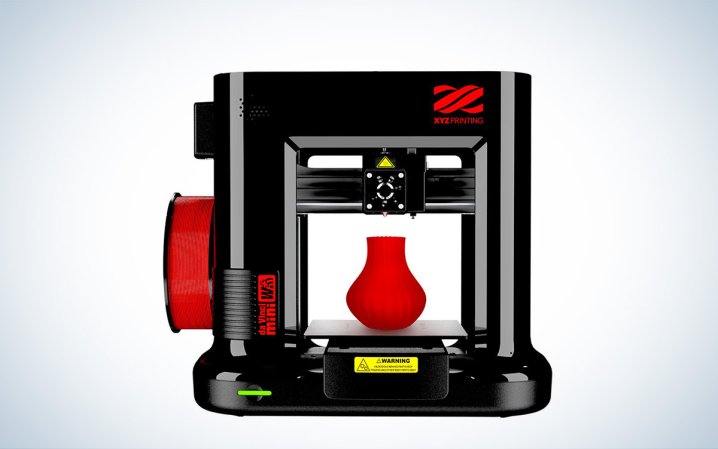  The black and red XYZprinting Da Vinci Mini Wireless 3D printer is places against a white background.