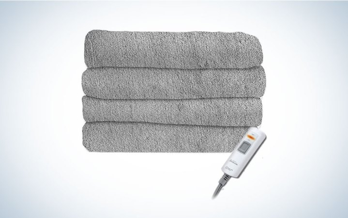  A gray Sunbeam heated blanket on a plain background