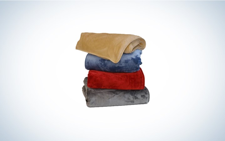  A stack of Warmee Electric Blankets on a plain background