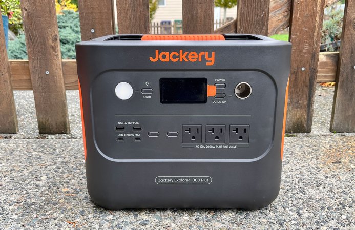  Orange and grey rectangular Jackery 1000 Plus portable generator on a patio