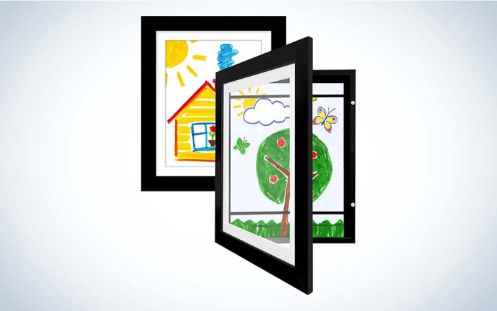  Two black picture frames that feature children's art.