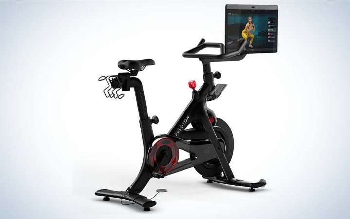  A black Peloton Bike Plus with a seat, handlebars, and a 24-inch touchscreen.