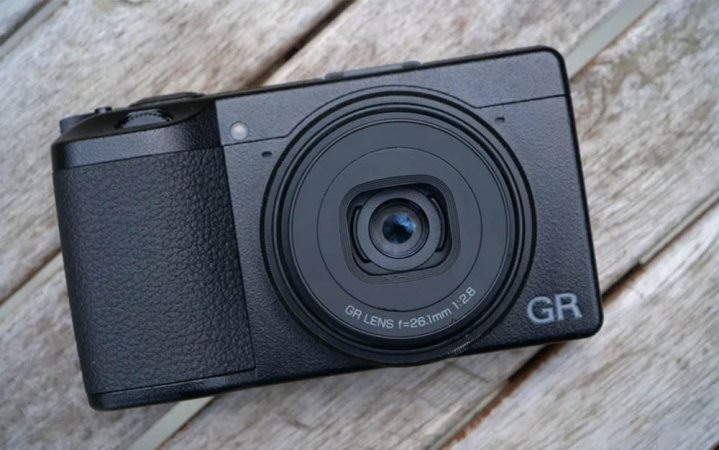  Black Ricoh GR IIIx on a wooden surface