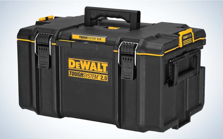  A durably built black toolbox with clasps holding it closed and the word "DeWalt" on the front.