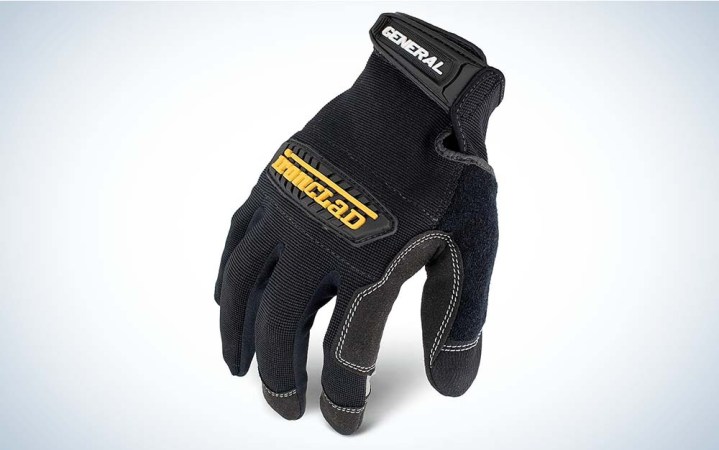  A black work glove with the fingers pointed down and the work Ironclad on the hand in yellow.