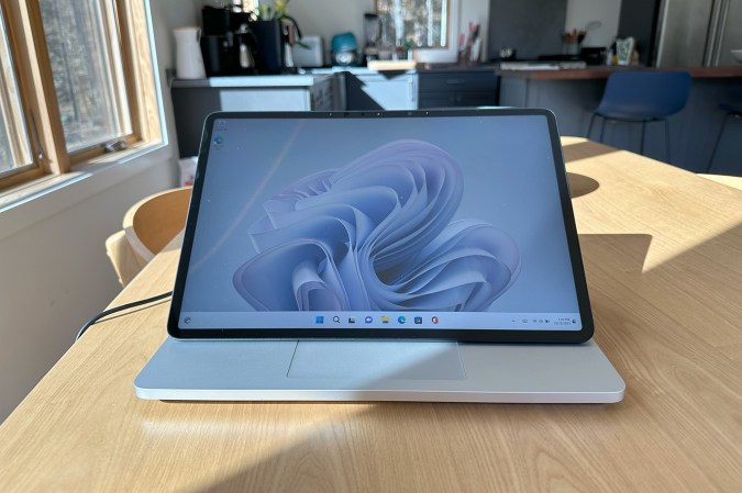  Blue and silver Microsoft Surface Laptop Studio 2 on a birch table