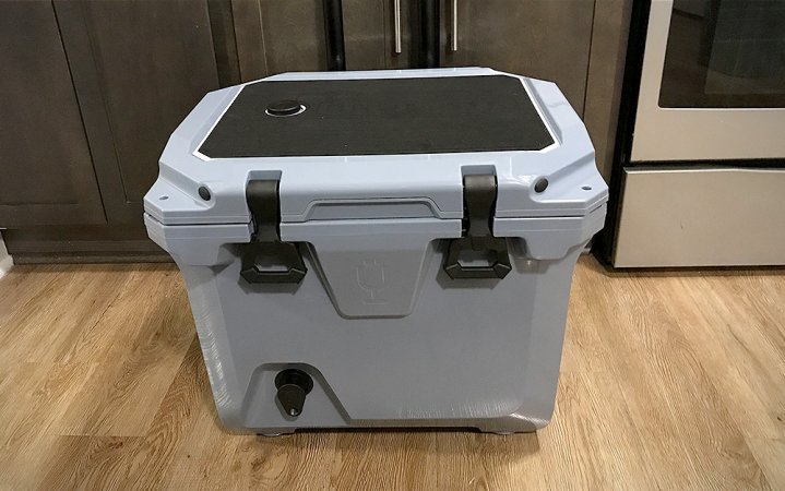  Light gray BruMate BruTank 35-quart rolling cooler sitting on a wood floor