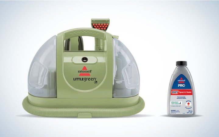  A Bissell Little Green carpet cleaner on a plain background