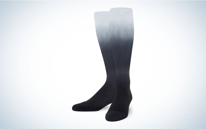  A pair of Comrad compression socks on a plain background