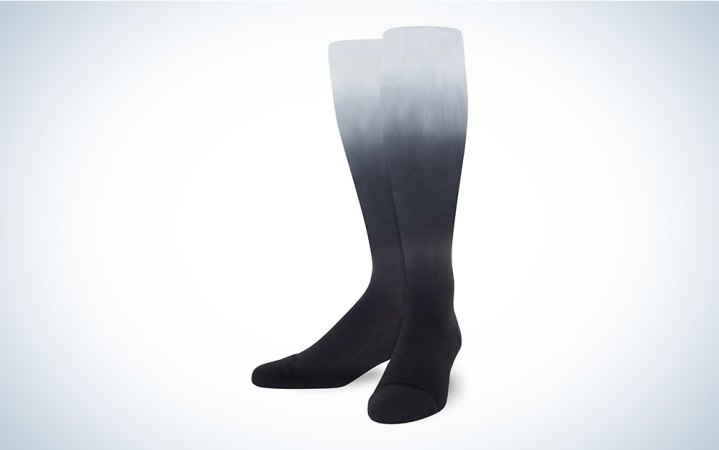  A pair of Comrad compression socks on a plain background