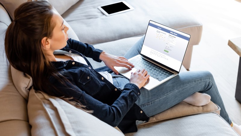 Woman using laptop to look at social media and health misinformation