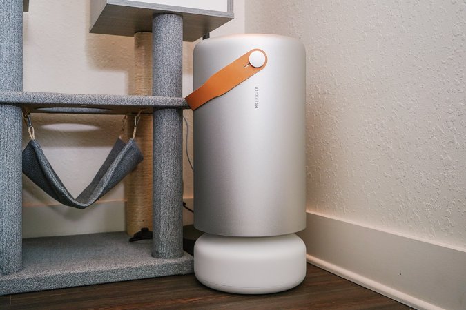  Molekule air pro air purifier for pets next to a cat tower