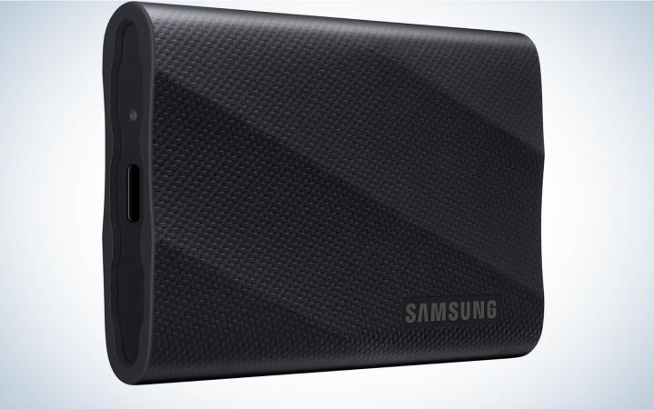  A samsung T9 portable SSD on a plain background