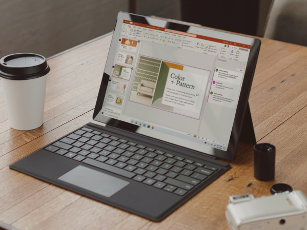 A Microsoft Surface tablet on a coffee shop table.