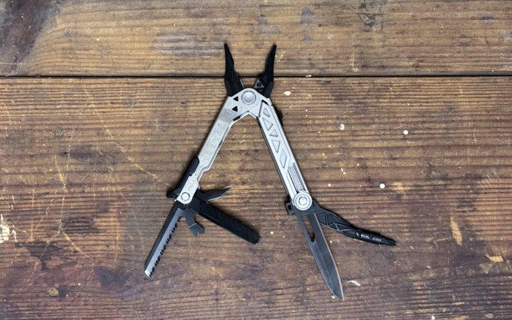  A Gerber Gear Center-Drive Multitool Bit Set on a plain wooden table.