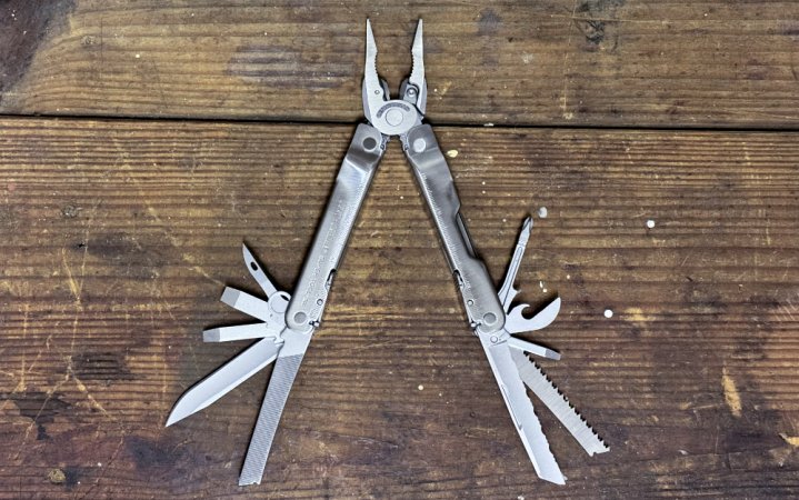  A Leatherman Super Tool 300 sitting on a wood table