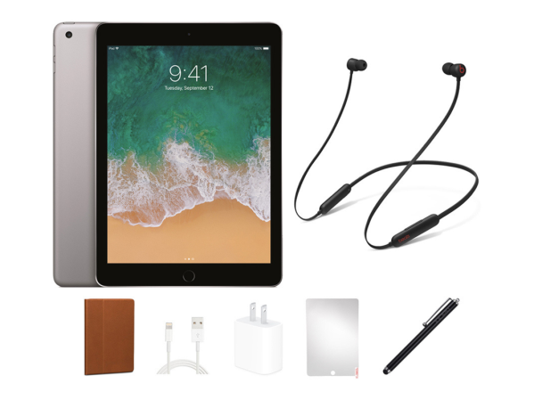 An iPad bundle with Beats Flex headphones on a plain background.