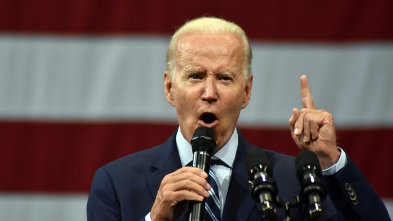 Joe Biden speaking in front of American flag