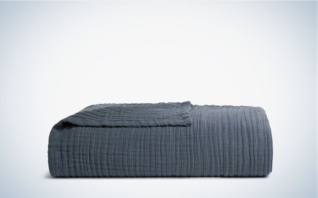 A navy Cloud Linen Gauze Bed Blanket on a plain background.